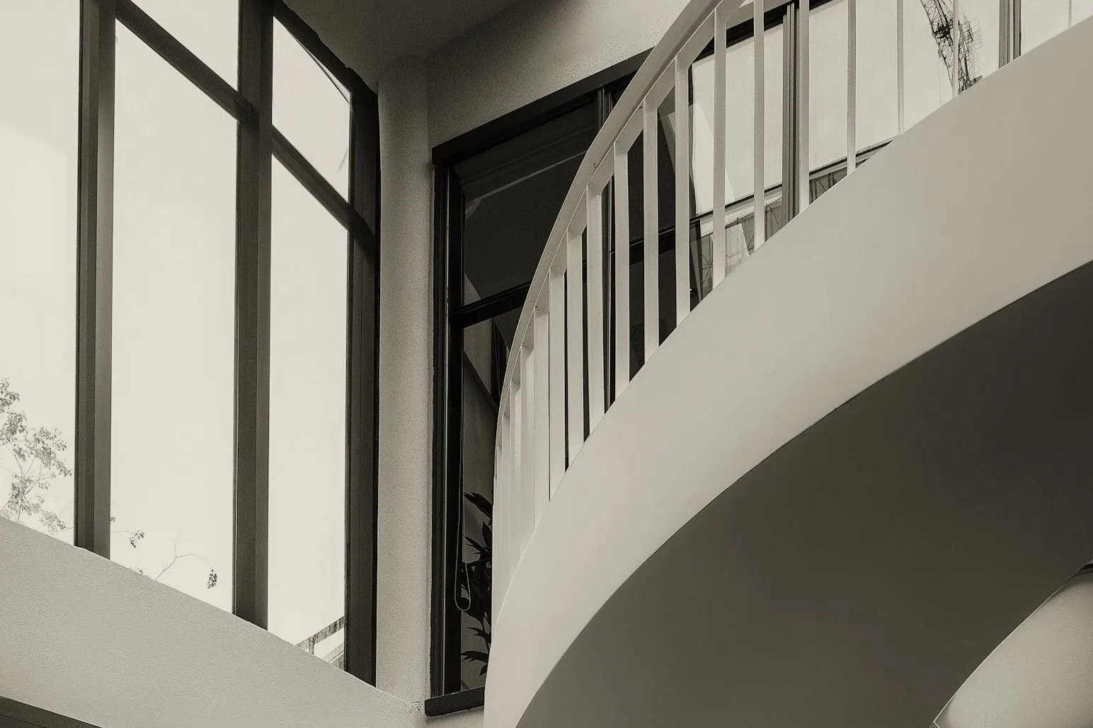 The spiral staircase rendered as an etched print - the five phases ascend the same way